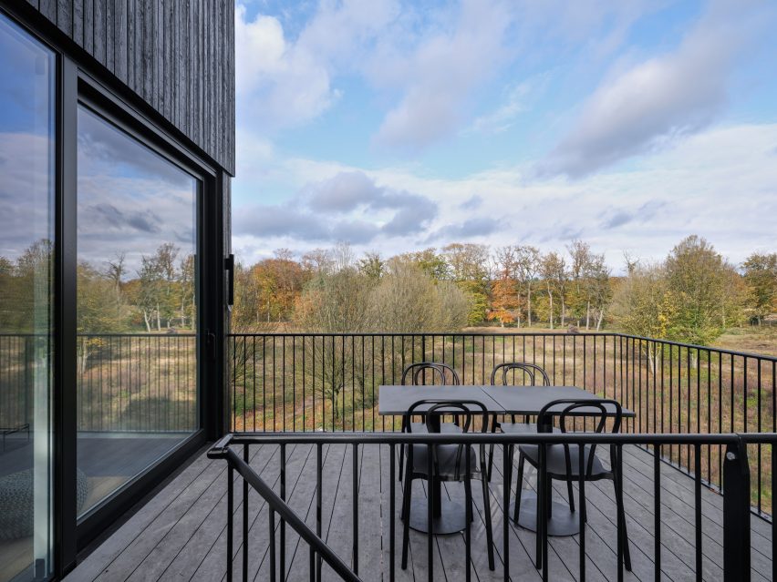 Terrace of timber-cladded holiday home in the woods