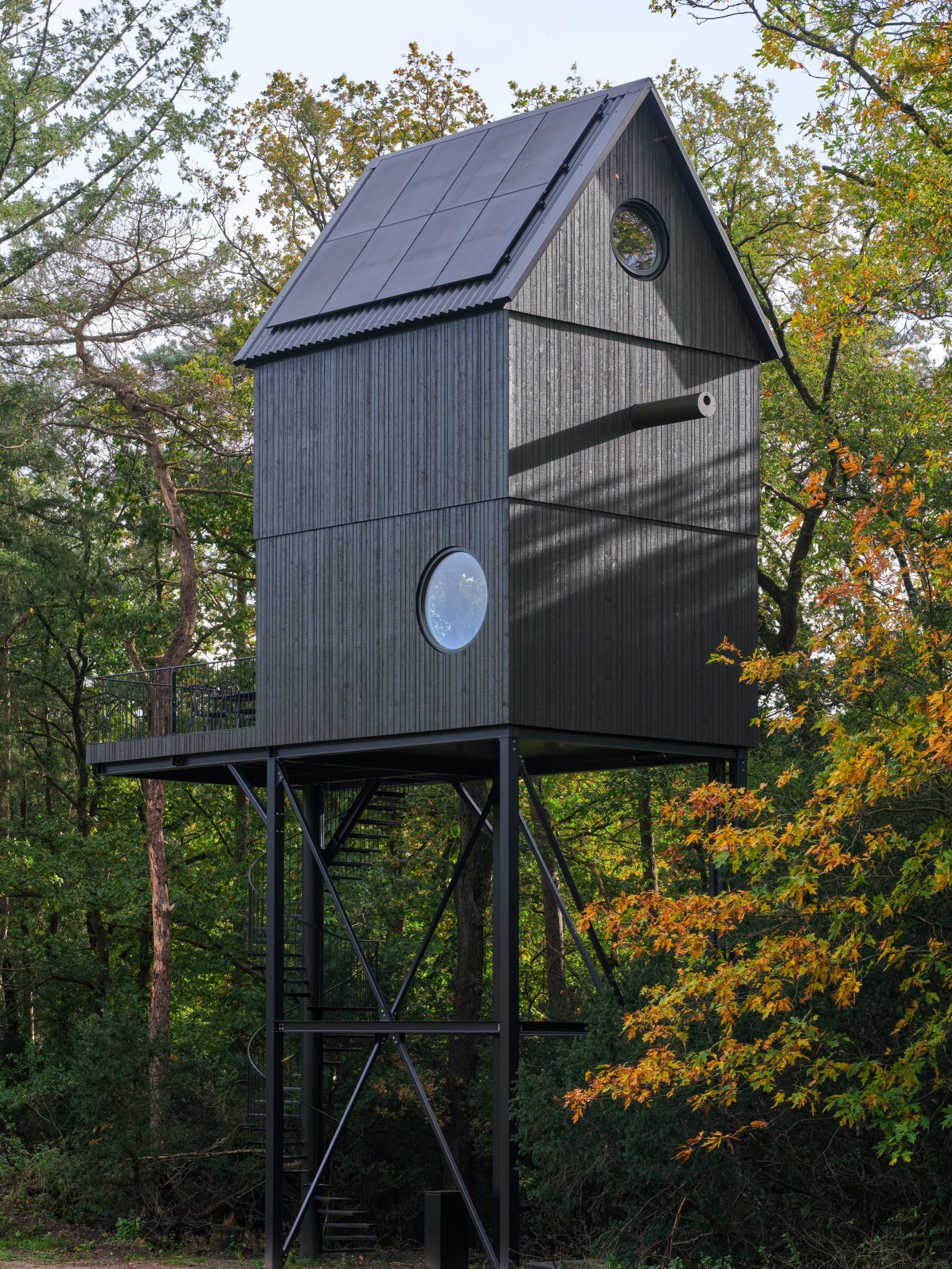 Timber-cladded home with solar panels on the roof