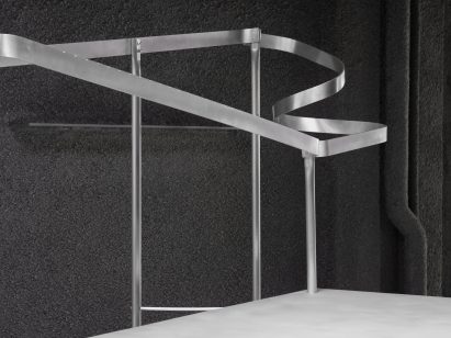 Metal rail inside Natalino boutique in London by Mooradian Studio