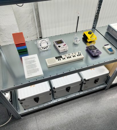 Tech examples in Nothing's King's Cross studio including calculators, Gameboys and Casio keyboard