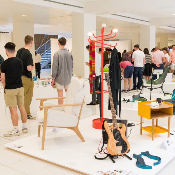 students at a product design exhibition