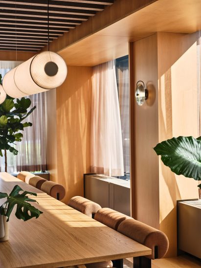 Communal table in wood-lined room