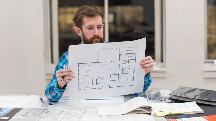 man reading building plan