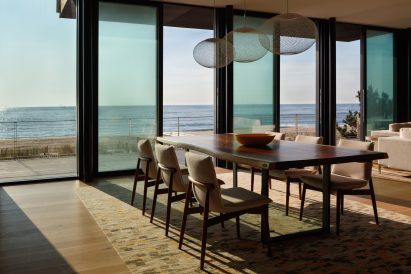 View of beach in Delaware through modern kitchen
