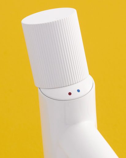 Hidden smiley face detail on white Nu tap with a Stripes handle by Inma Bermudez