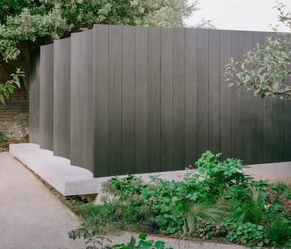 Exterior of Shou Sugi Bangers music studio in London garden