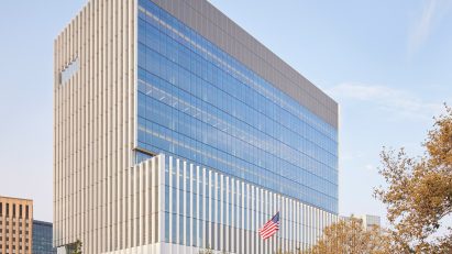 Aluminium building with glass facade and flag