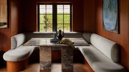 U-shaped breakfast nook in a wood-lined interior