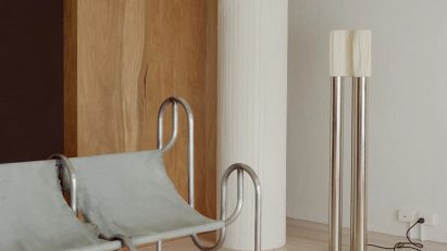 Grey chairs in living room with white column in corner