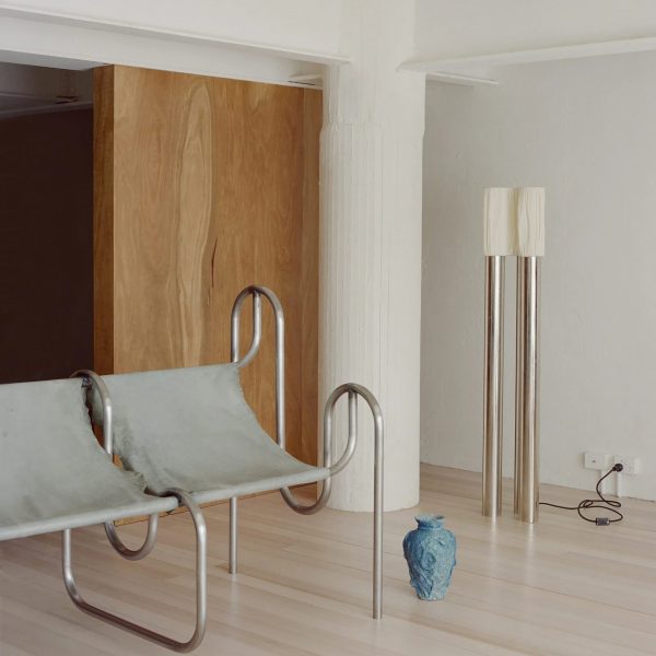 Grey chairs in living room with white column in corner