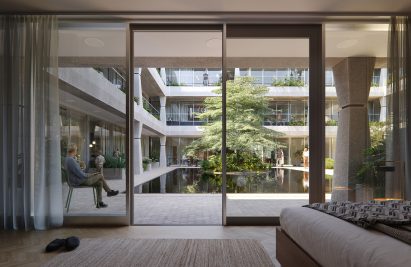 Living room looking on a courtyard with a pool