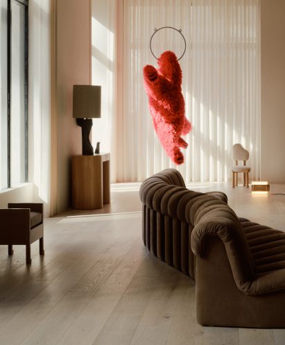 Gallery with hanging bear sculpture by Italian artist Paola Pivi in the background