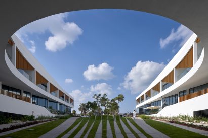 View of central plaza and residential wings at complex by Tariq Khayyat Design Partners