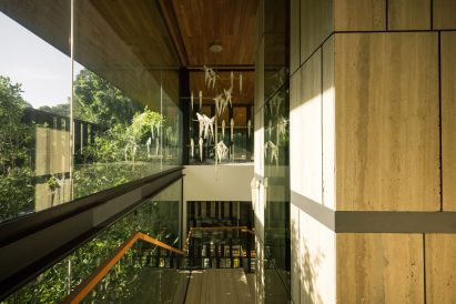 View of staircase within home by Wallflower Architecture + Design
