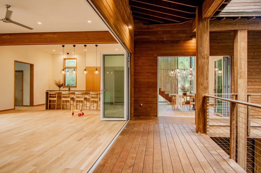A kitchen area that leads out onto a porch