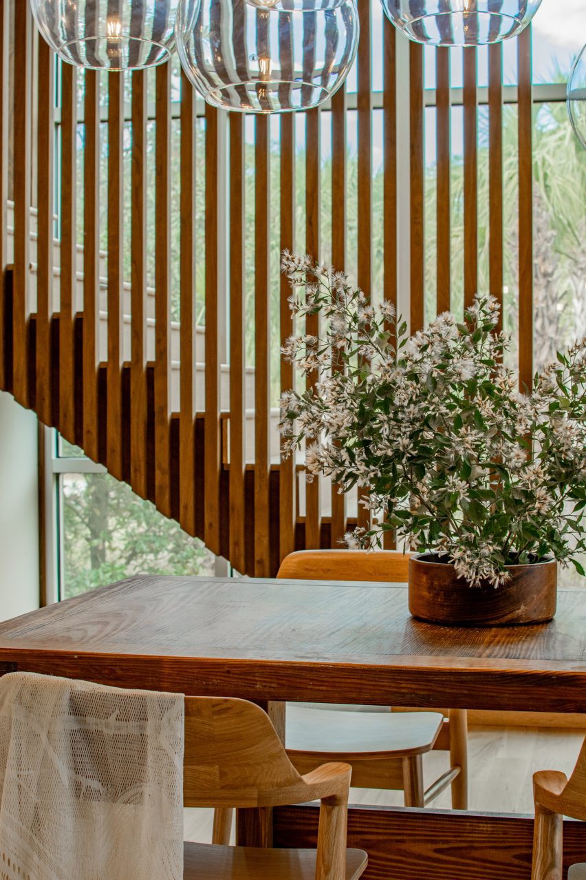 A staircase with table and plant