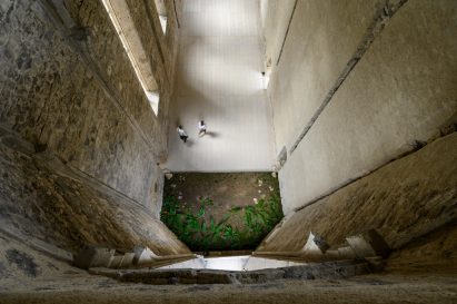Repaired wall and raised flooring in church at the Žiče Charterhouse by Medprostor in Slovenia