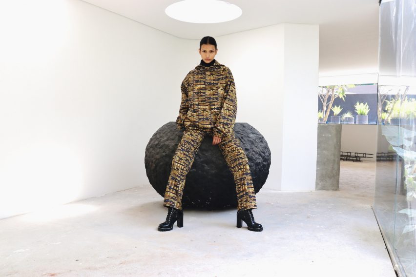 Person sitting on circular stool