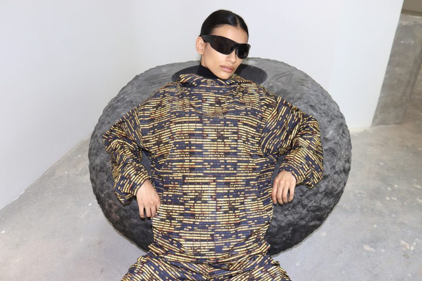 Person sitting on circular stool