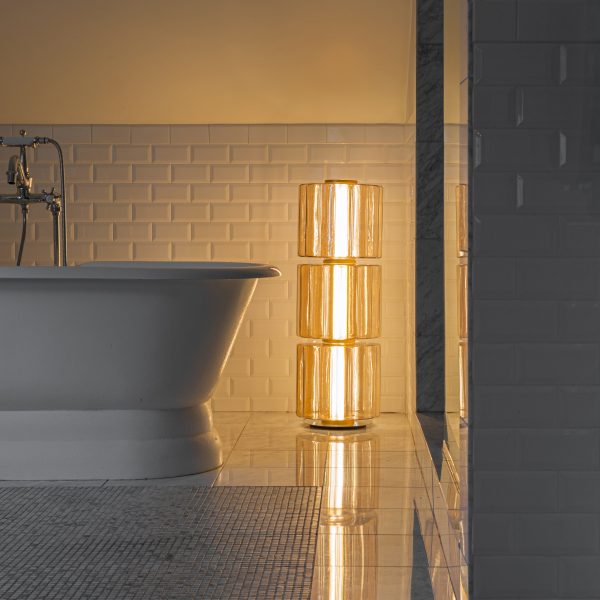 Photo of lamp by A-N-D next to a bath