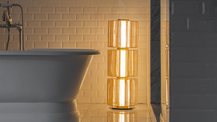 Photo of lamp by A-N-D next to a bath
