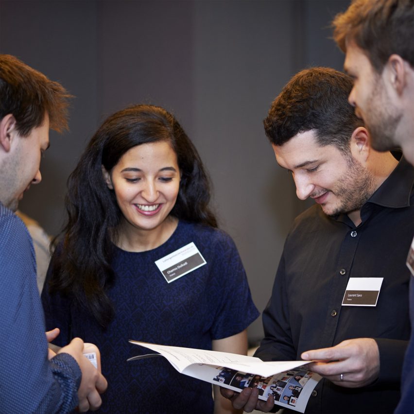 People reading from a brochure