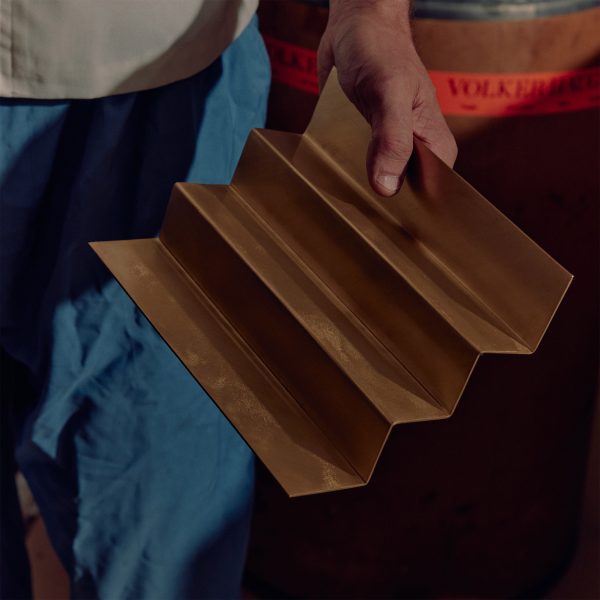 Photo of person holding corrugated metal