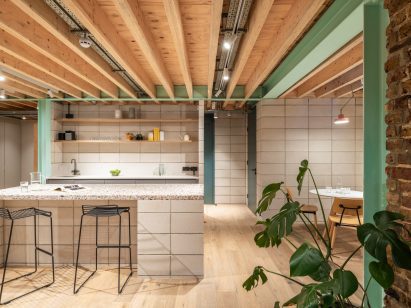 Kitchen with terrazzo counter of Addison Studios by Tigg + Coll Architects