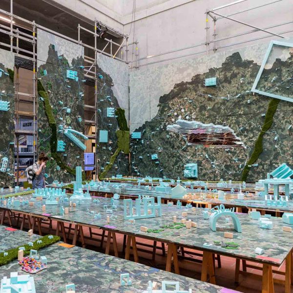 a visualisation of an abstract space in tones of green, blue and beige