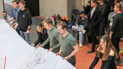 Students holding a banner