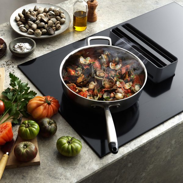 Photo of food cooking on a hob