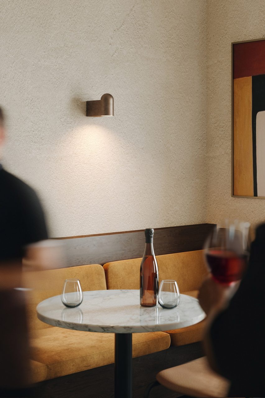 Restaurant interior with bronze Bell lighting by Aftr for Rakumba