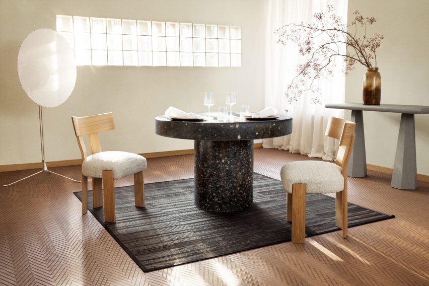 Rug on top of a carpet in a dining area