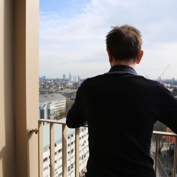 Charles Curtis looking out from his balcony at Daventry House