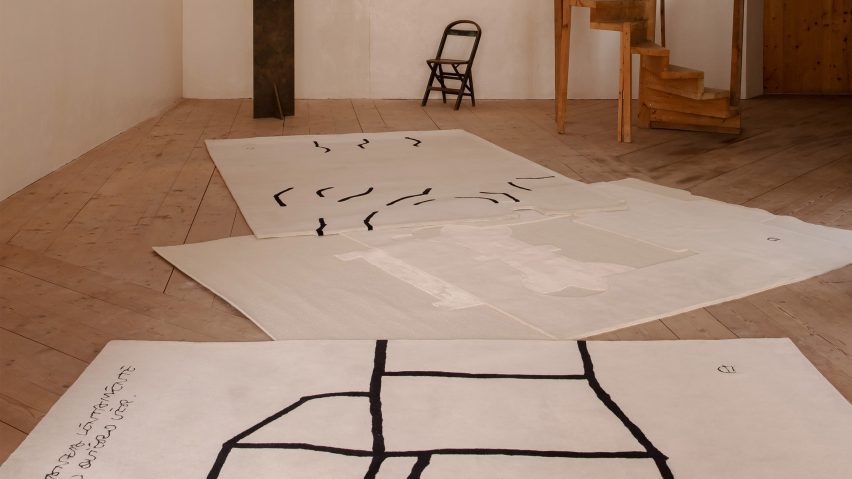 Monochromatic rugs on wooden floor