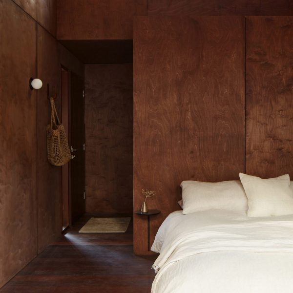 Shadow House, Australia, by Grotto Studio with chocolate brown walls