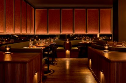 Booth seating with crackled plaster wall panels above