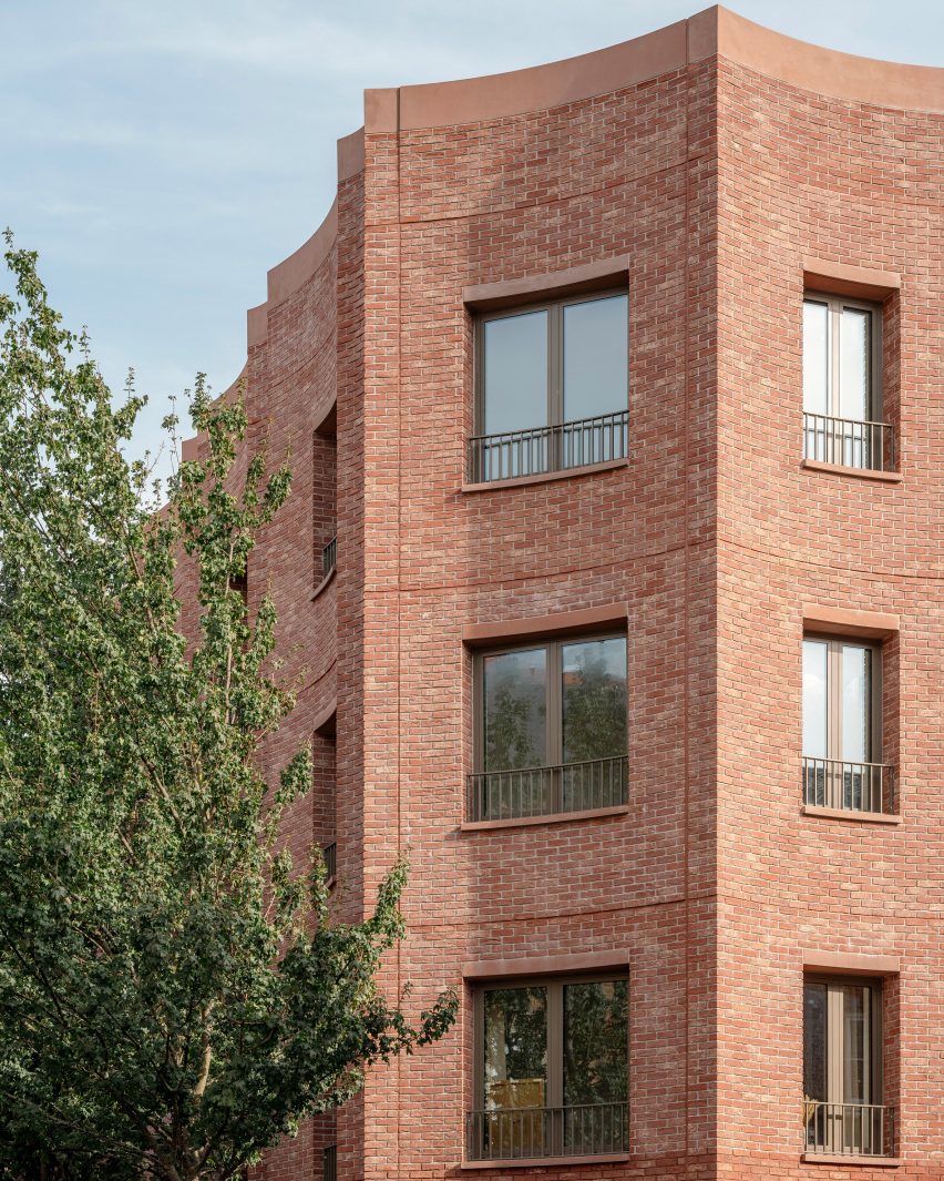 Scalloped red brick building facade