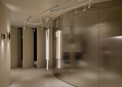 A room with a curving metal wall