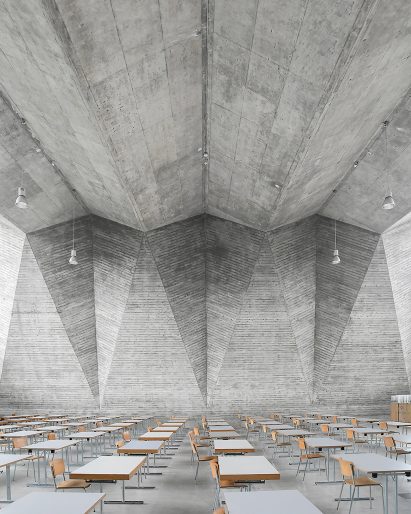 Brutalist interior of the Maurerhalle lecture theatre in Basel, Switzerland