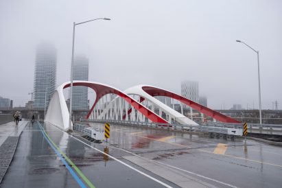 Two white Port Lands Bridges with foggy skyline in the back