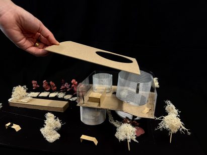 Image of an architectural model with a removable roof