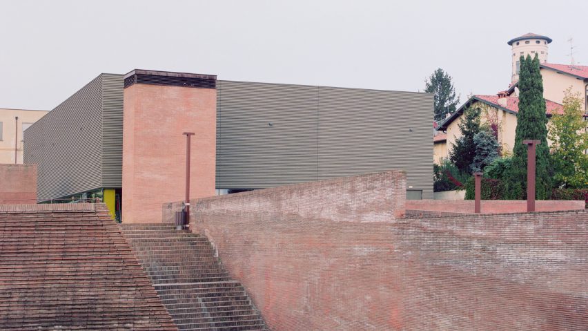 Concrete-clad gym in a brick piazza by MD41