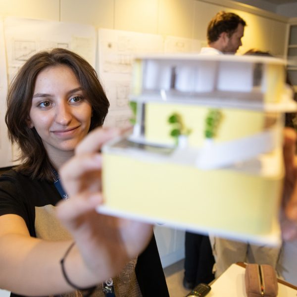 Student showing her architectural model