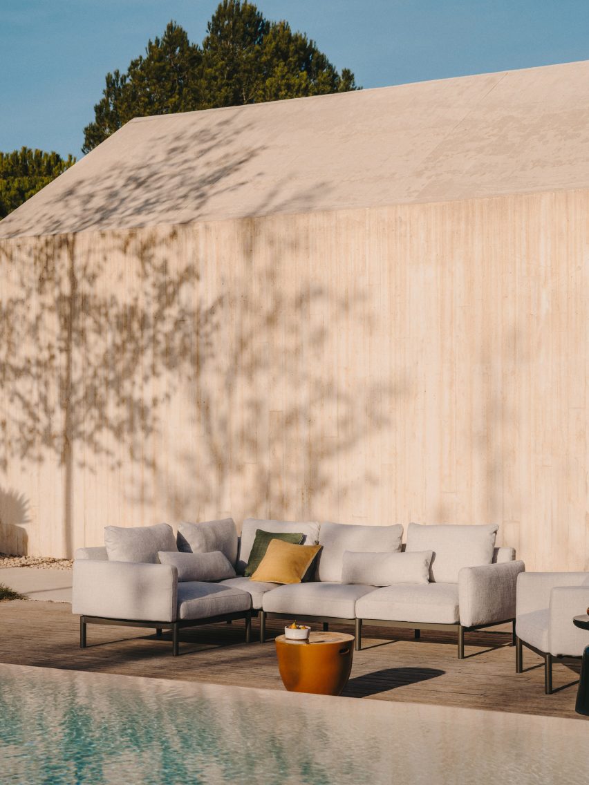 L-shaped sofa by a pool