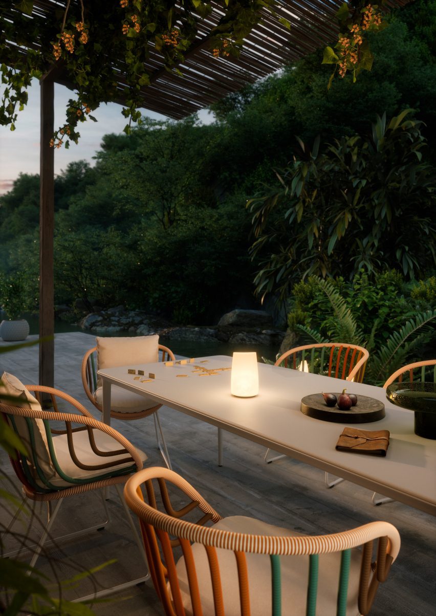 Close-up photo of Dedon's Kida mulitcoloured armchairs around an outdoor table