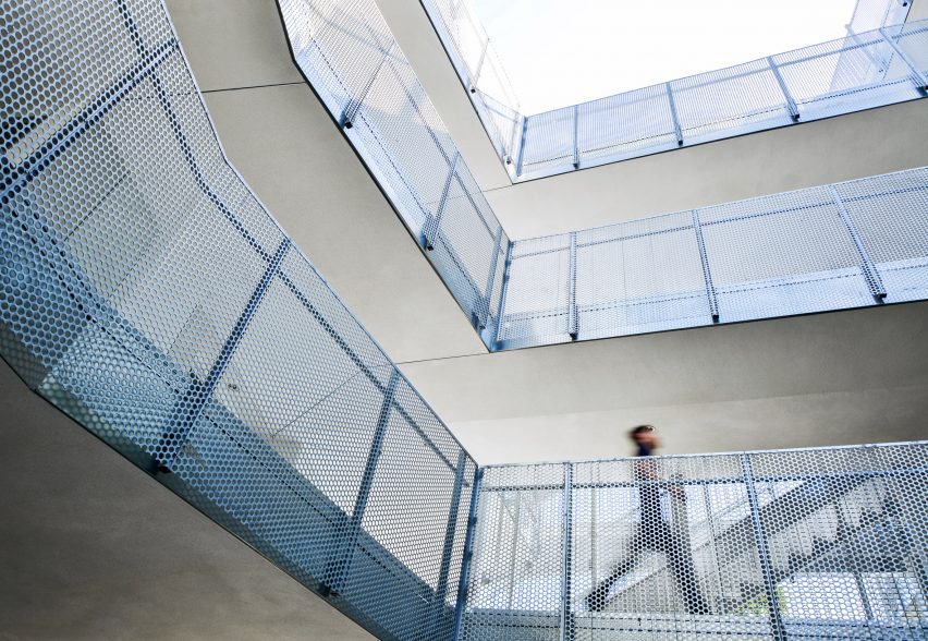 Person walking along staircase Bran Arifin