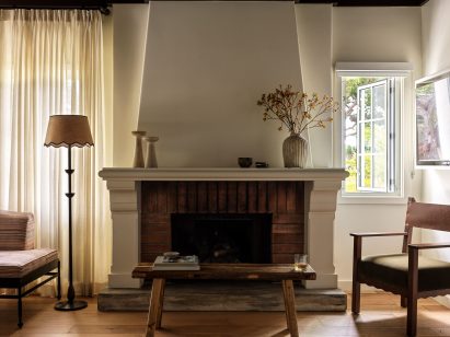 Guest suite with a grand fireplace