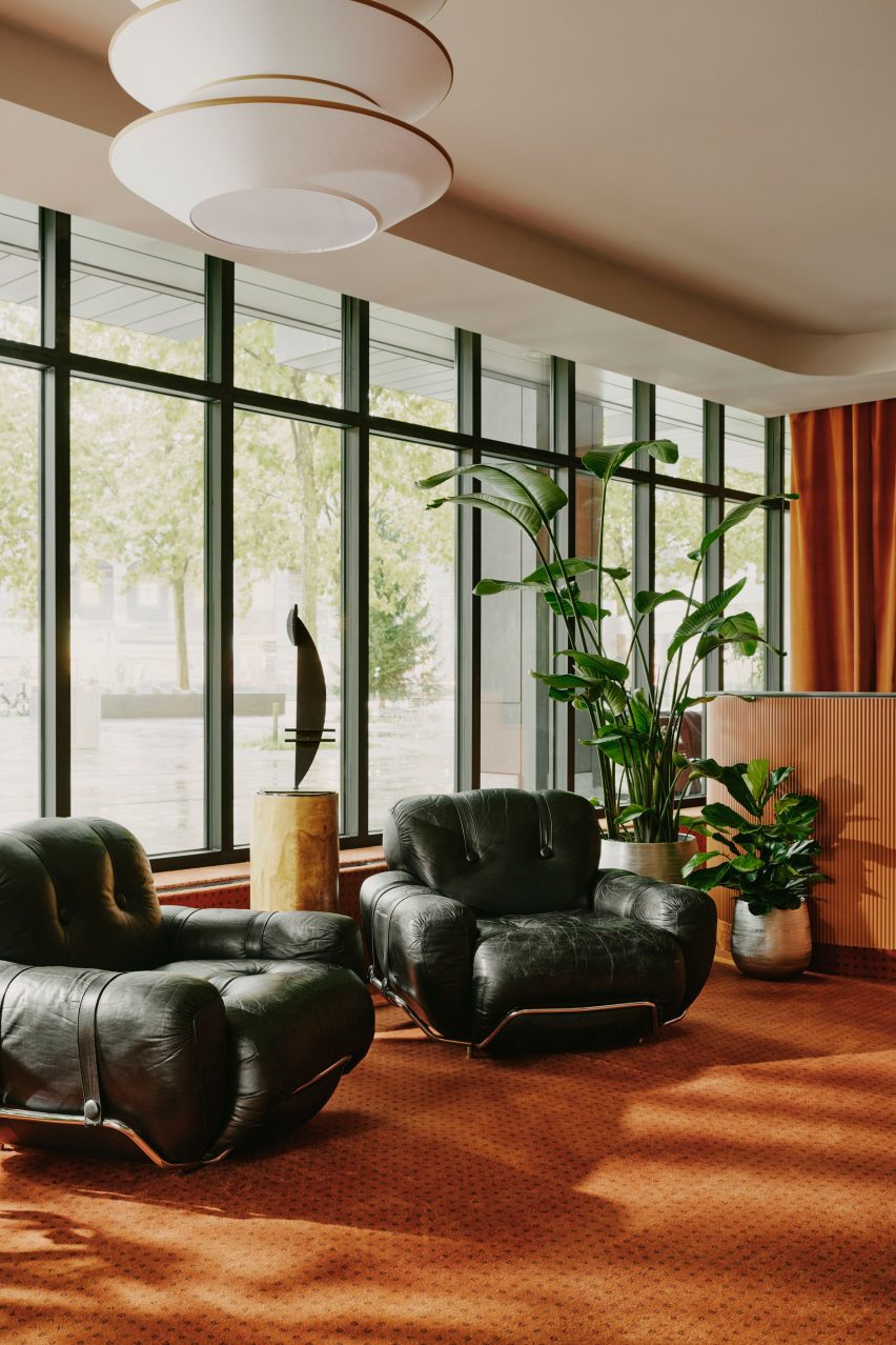 Floor-to-ceiling windows and seating in reception area of hotel Zurich