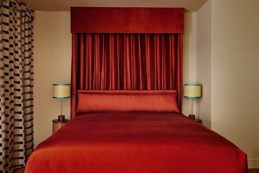 Red bed and yellow lamps Locke hotel Switzerland